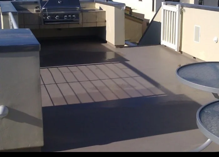 Balcony deck with a tiled surface and white railing
