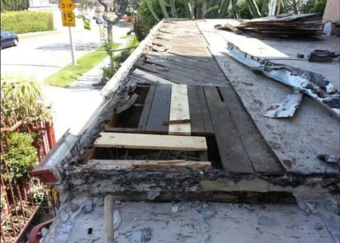 Deck stripped back to its exposed framing during repair